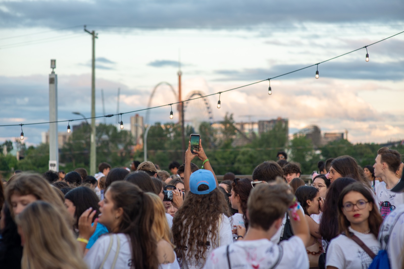 Evening campus event under string lights