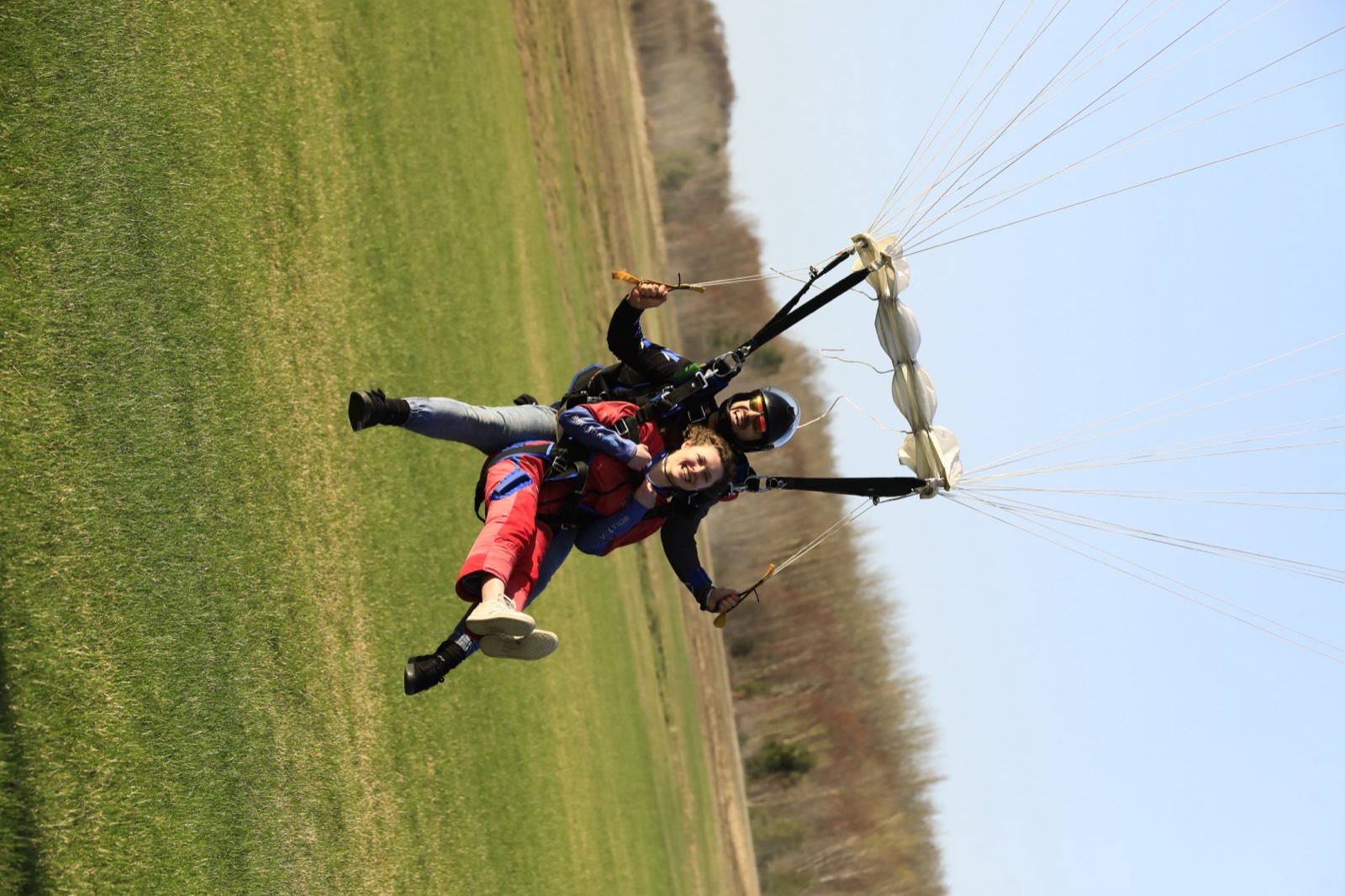 Skydiving club landing in an open field